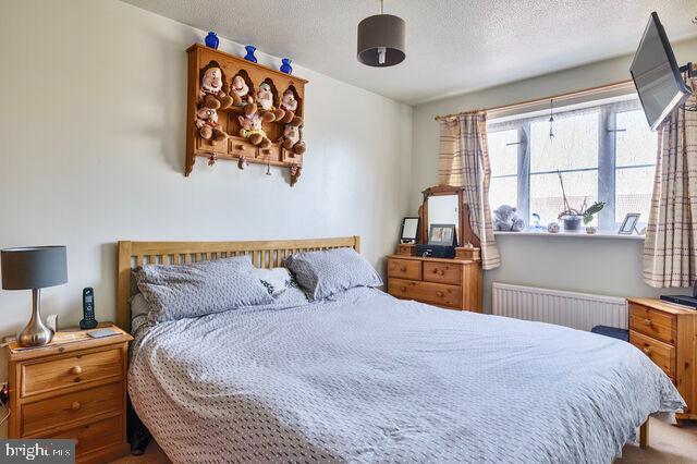 1633 D Street Southeast Washington, DC 20003 - Photo 24 of 38 a bedroom with a bed and wooden floor