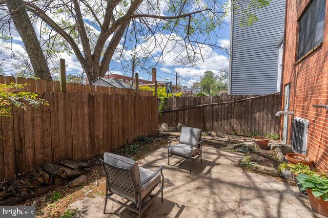 1633 D Street Southeast Washington, DC 20003 - Photo 37 of 38 a view of a chairs and tables in the back yard of the house