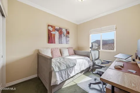 a bed room with a bed and a window