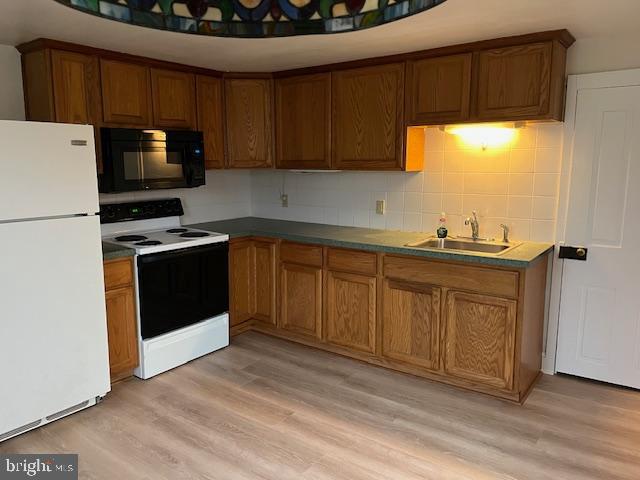 3617 Ferry Road, Unit 3 Fountainville, PA 18923 - Photo 1 of 8 a kitchen with stainless steel appliances a stove a sink and a microwave