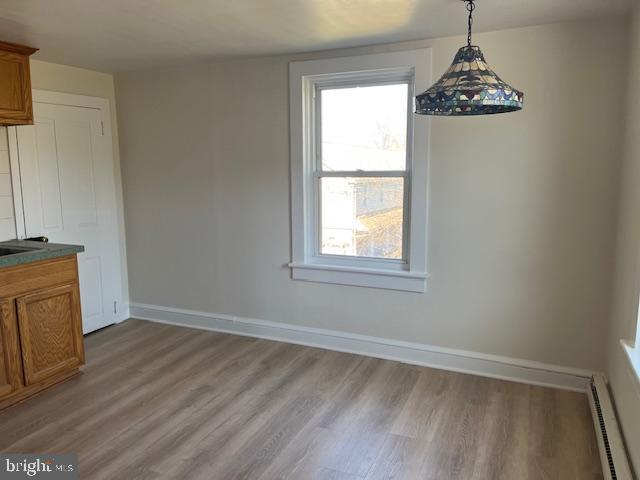 3617 Ferry Road, Unit 3 Fountainville, PA 18923 - Photo 3 of 8 an empty room with window and wooden floor