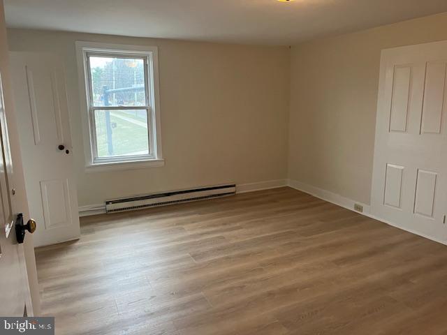 3617 Ferry Road, Unit 3 Fountainville, PA 18923 - Photo 6 of 8 an empty room with wooden floor and windows