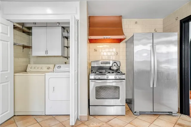 a living room with furniture fireplace and a large window