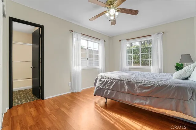 a bathroom with a sink a mirror a vanity and toilet