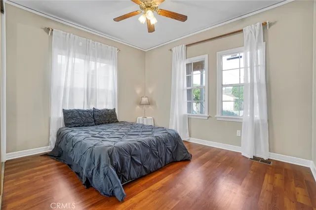 a large kitchen with kitchen island granite countertop a sink and a stove top oven