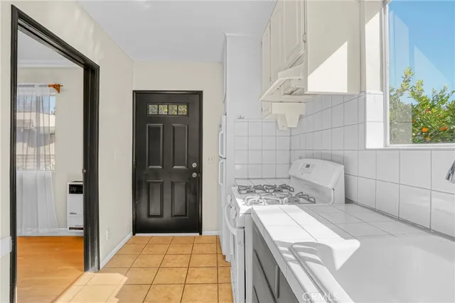 a bathroom with a sink a vanity and a shower