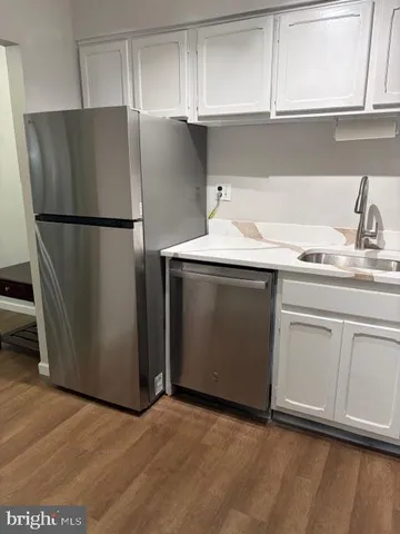 a kitchen with appliances and cabinets