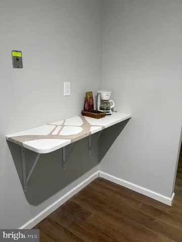 a room with a sink and a mirror