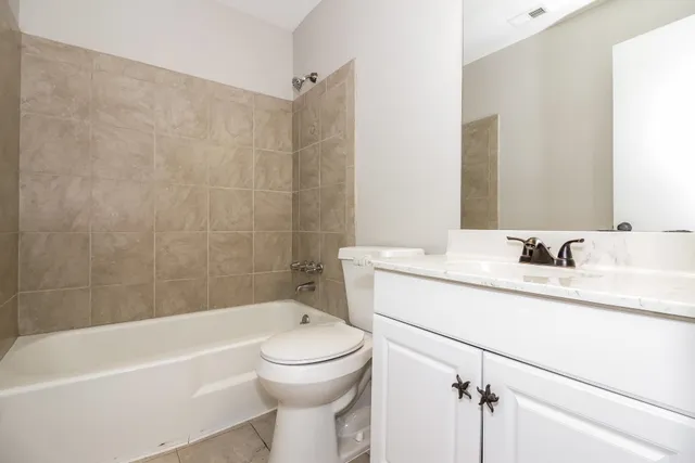 a bathroom with a sink a toilet and a bathtub