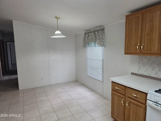 a view of cabinets and wooden floor
