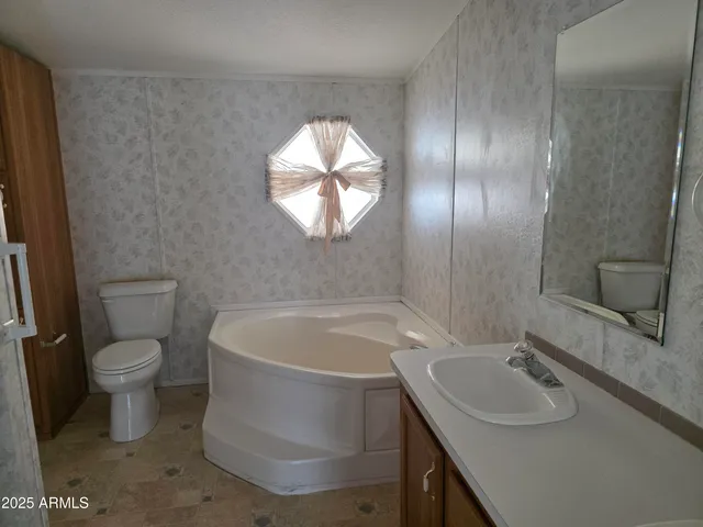 a bathroom with a sink and a toilet