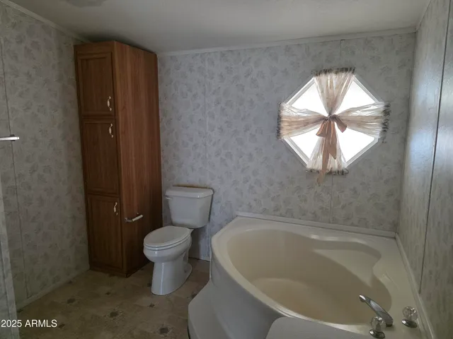 a bathroom with a toilet and a sink