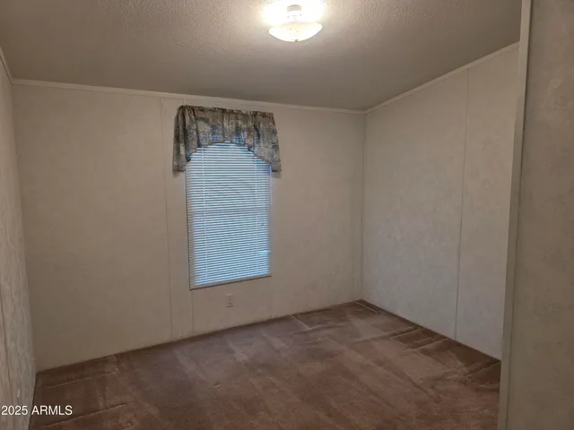 a view of an empty room and a window