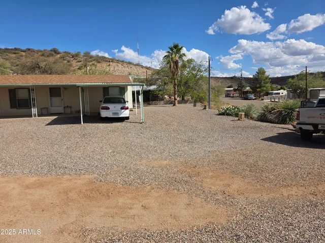 a view of a car parked in front of a house