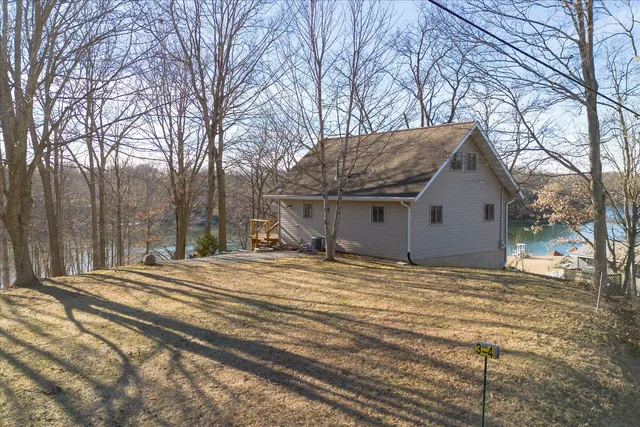 a view of a house with snow on the background
