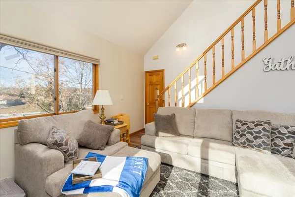 a living room with furniture and large windows