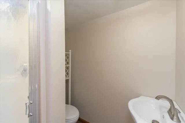 a bathroom with a toilet and sink