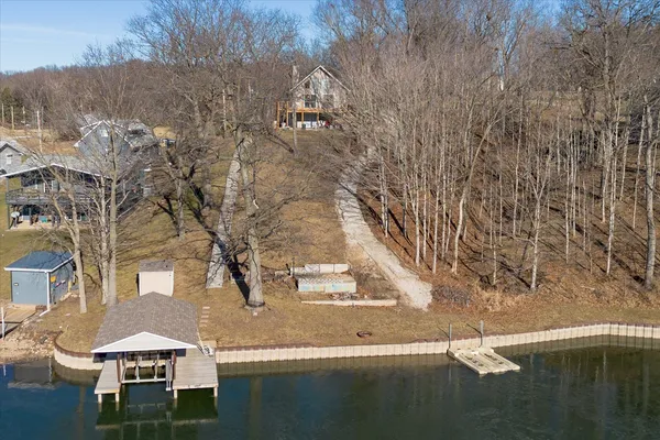 a view of house with outdoor space and sitting area