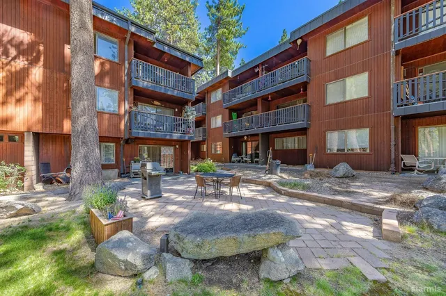 a view of a building with a yard