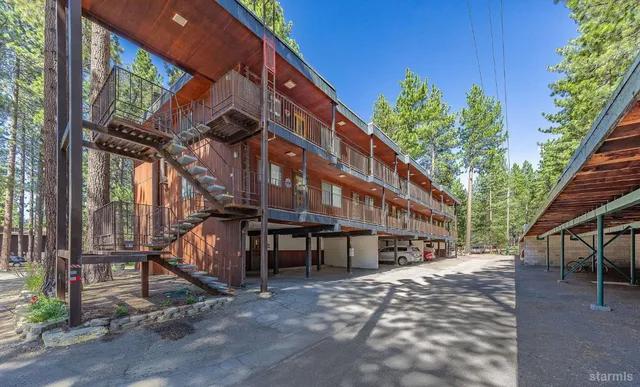 a view of a building with a backyard