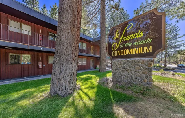 a sign that is on a brick wall