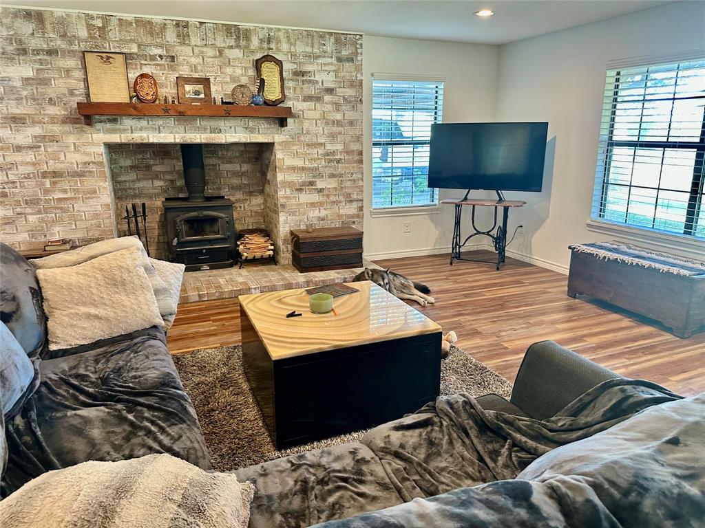 2387 Forehand Road Trinidad, TX 75163 - Photo 10 of 25 a living room with furniture and a fireplace