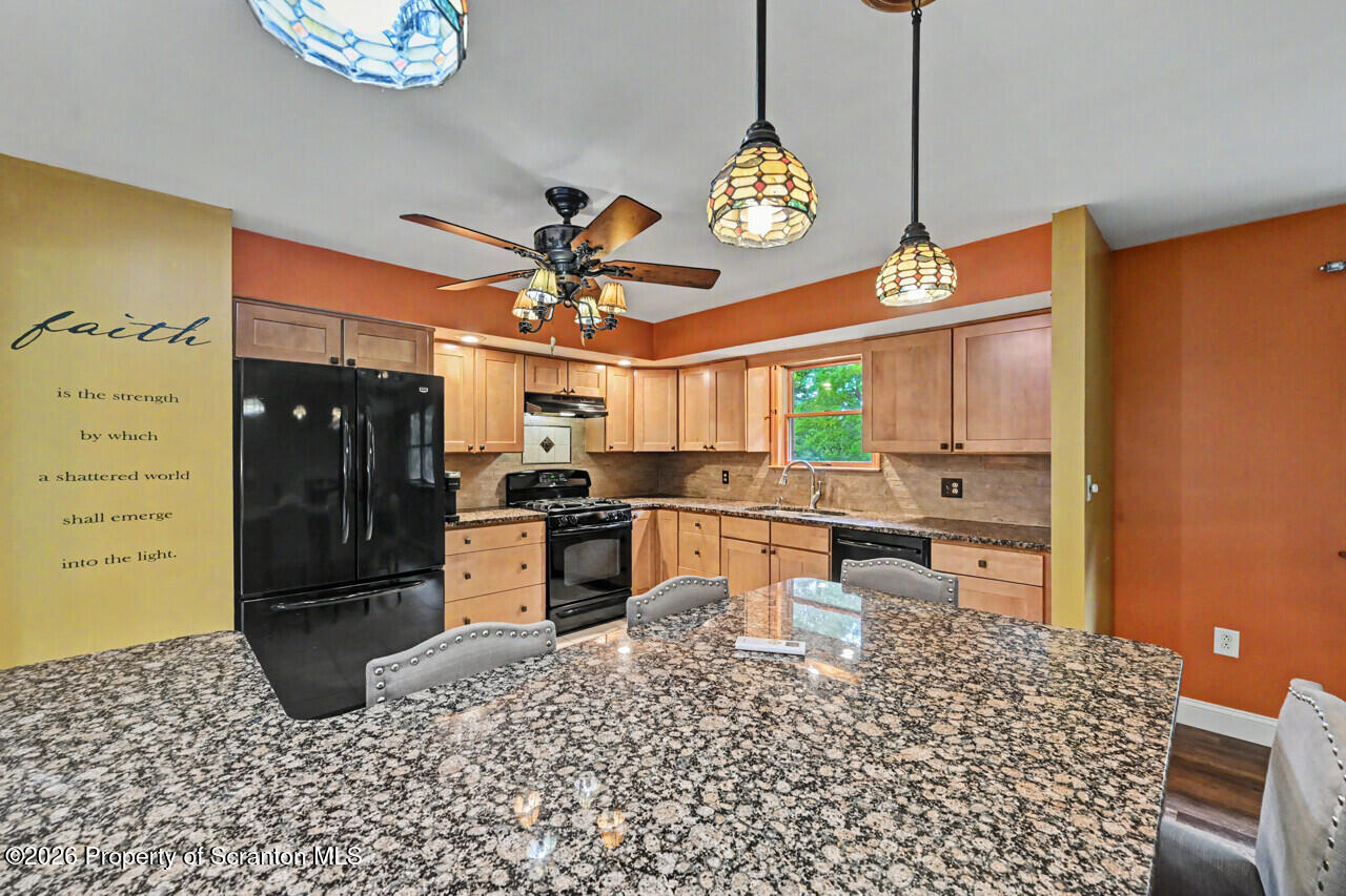 211 Buckingham Street Moscow, PA 18444 - Photo 26 of 83 a kitchen with a refrigerator and a sink