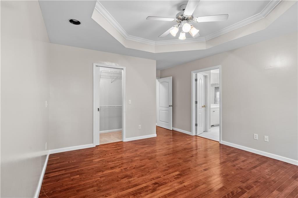 137 Hunters Trail Calhoun, GA 30701 - Photo 13 of 33 wooden floor in an empty room with a window
