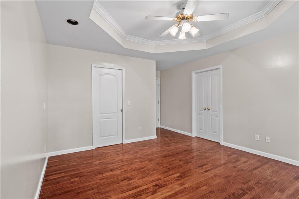 137 Hunters Trail Calhoun, GA 30701 - Photo 14 of 33 wooden floor in an empty room with a window