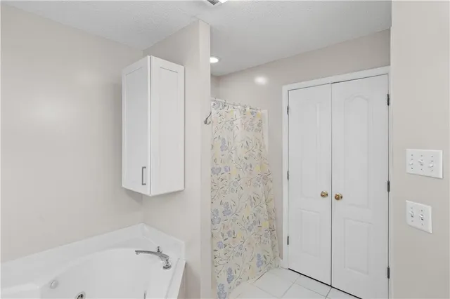 a bathroom with a shower and a tub