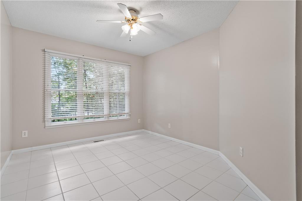 137 Hunters Trail Calhoun, GA 30701 - Photo 24 of 33 a view of an empty room with a window