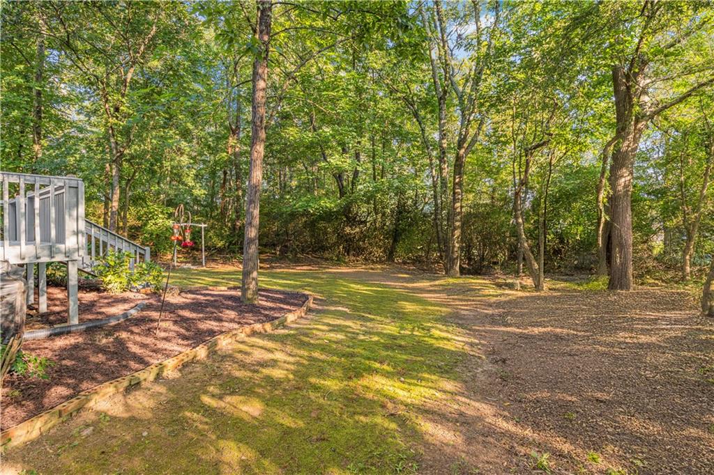 137 Hunters Trail Calhoun, GA 30701 - Photo 28 of 33 a view of a yard with basketball court