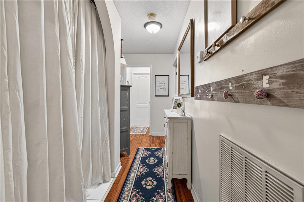 137 Hunters Trail Calhoun, GA 30701 - Photo 31 of 33 a walk in closet with wooden floor washer and dryer