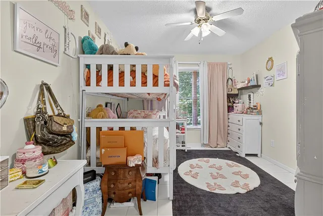 a bedroom with furniture and a wooden floor