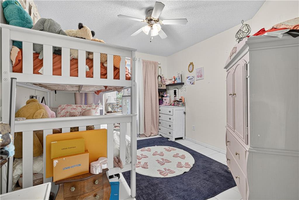 137 Hunters Trail Calhoun, GA 30701 - Photo 33 of 33 a living room with furniture and baby crib