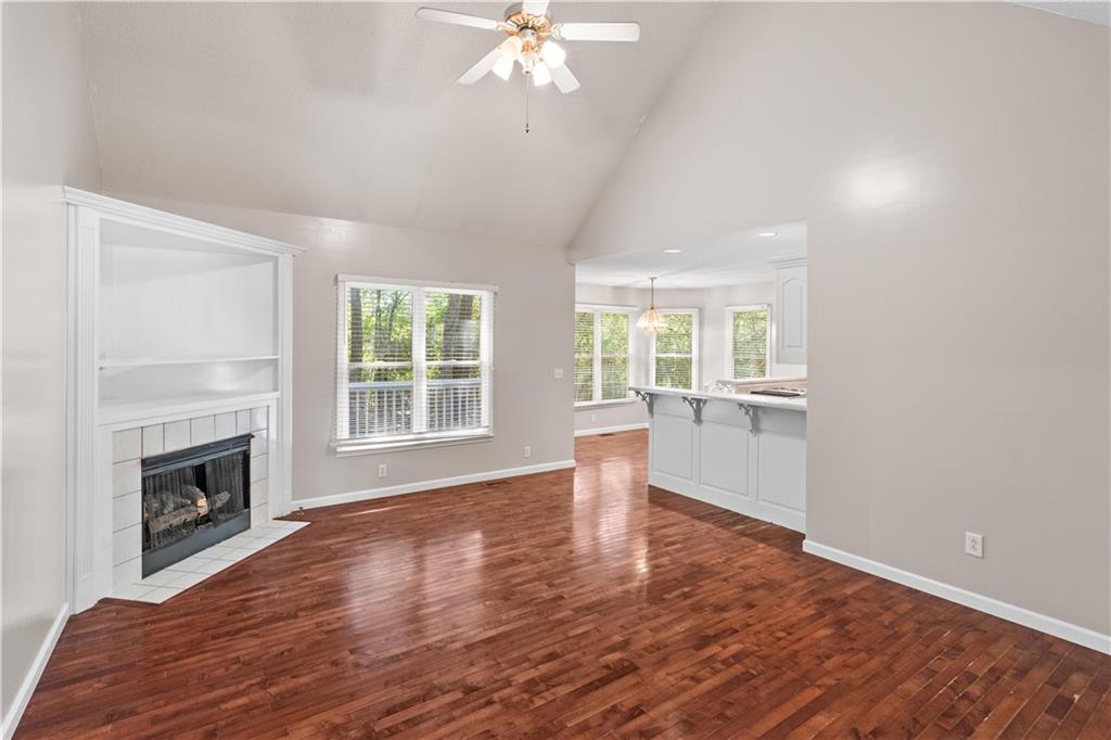 137 Hunters Trail Calhoun, GA 30701 - Photo 5 of 33 a view of empty room with wooden floor and fireplace