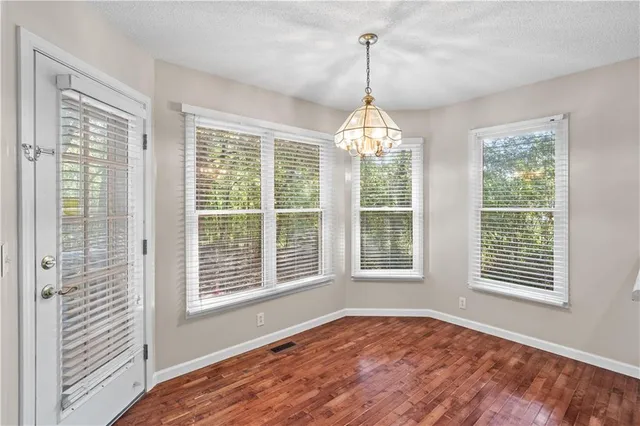 a view of an empty room with windows