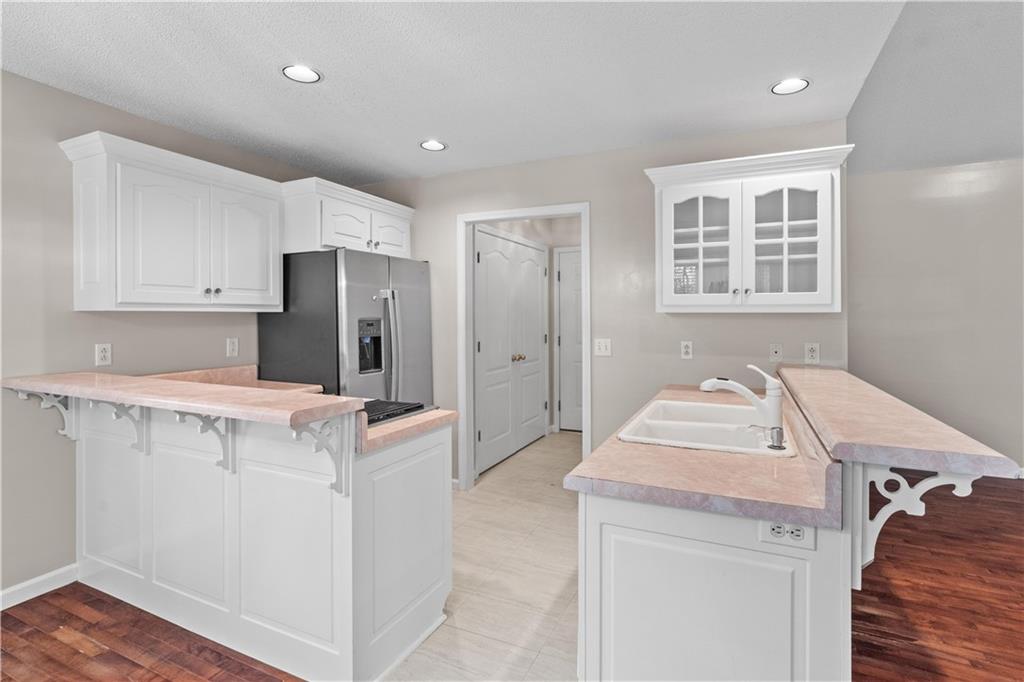 137 Hunters Trail Calhoun, GA 30701 - Photo 10 of 33 a kitchen with a refrigerator and sink
