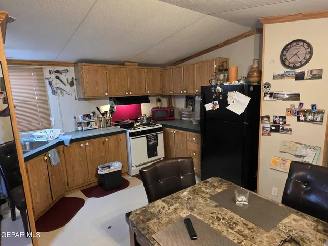 a bedroom with furniture and a flat screen tv
