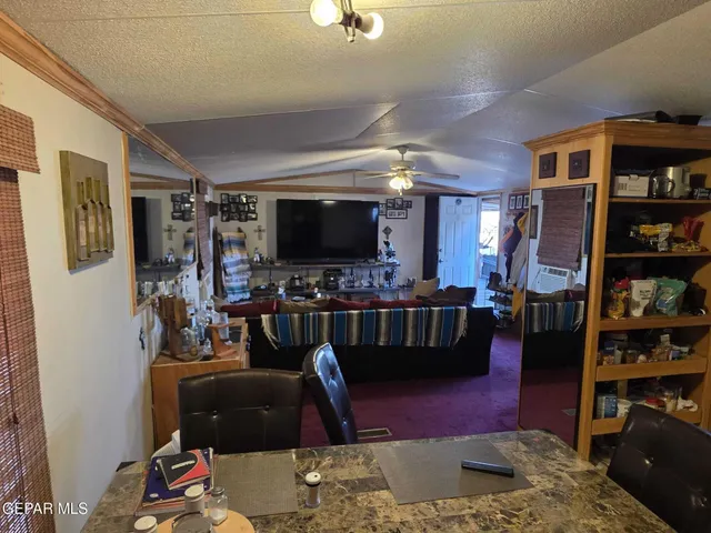 a view of a wooden fence next to a road