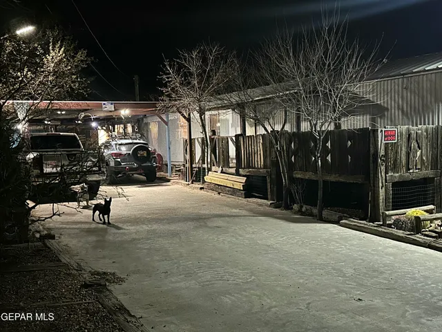 a kitchen with stainless steel appliances granite countertop a sink dishwasher stove and refrigerator