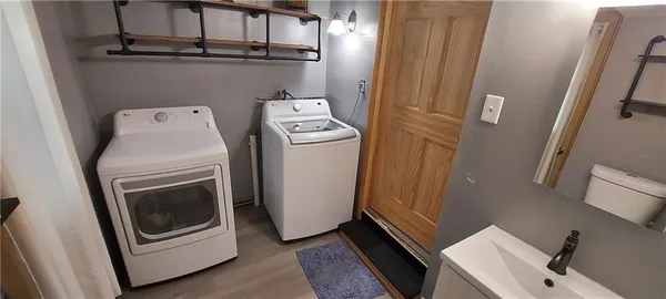 a utility room with dryer and washer