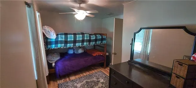 a bedroom with bed and a window