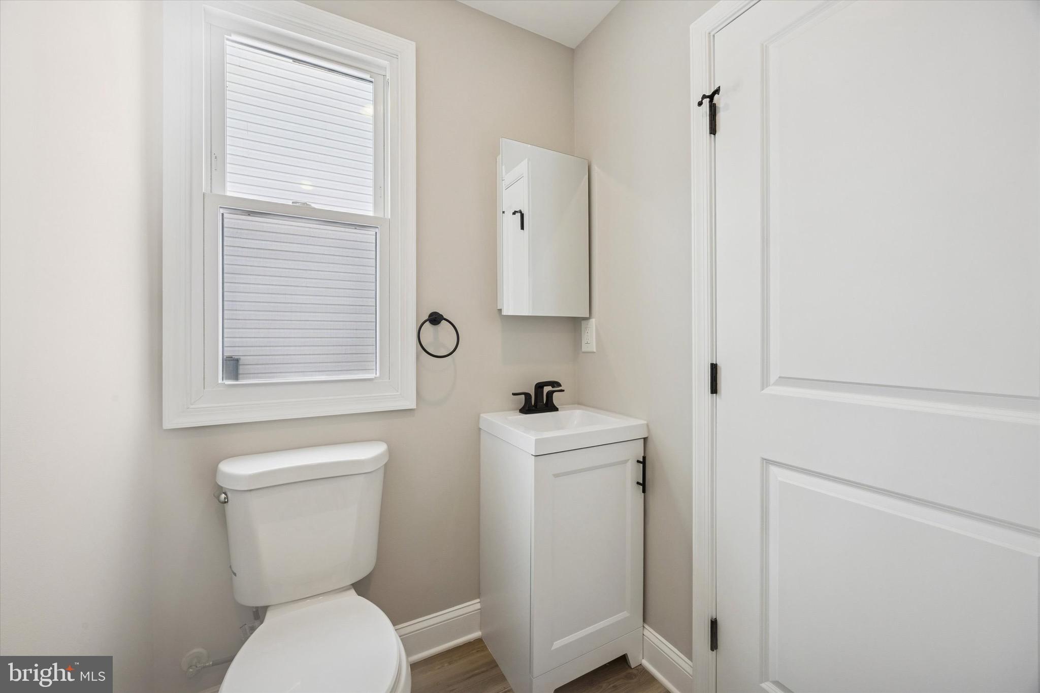 19 Rivanna Road New Castle, DE 19720 - Photo 14 of 26 a bathroom with a toilet sink and mirror