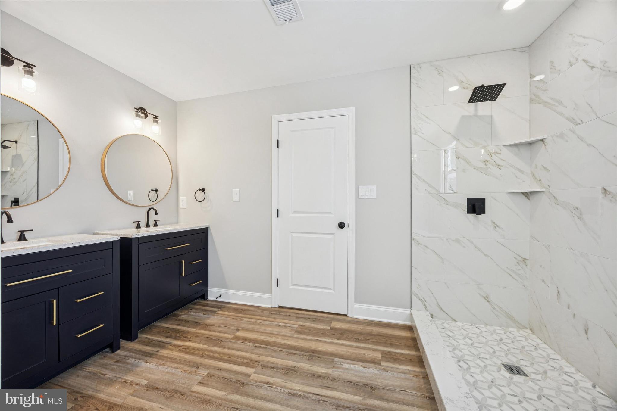 19 Rivanna Road New Castle, DE 19720 - Photo 19 of 26 a spacious bathroom with a double vanity sink mirror and shower