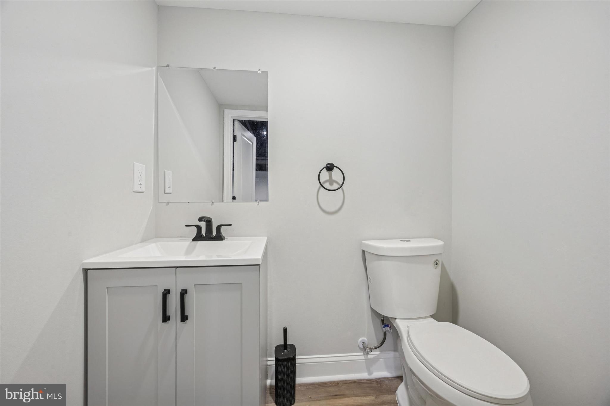 19 Rivanna Road New Castle, DE 19720 - Photo 23 of 26 a bathroom with a toilet a sink and mirror
