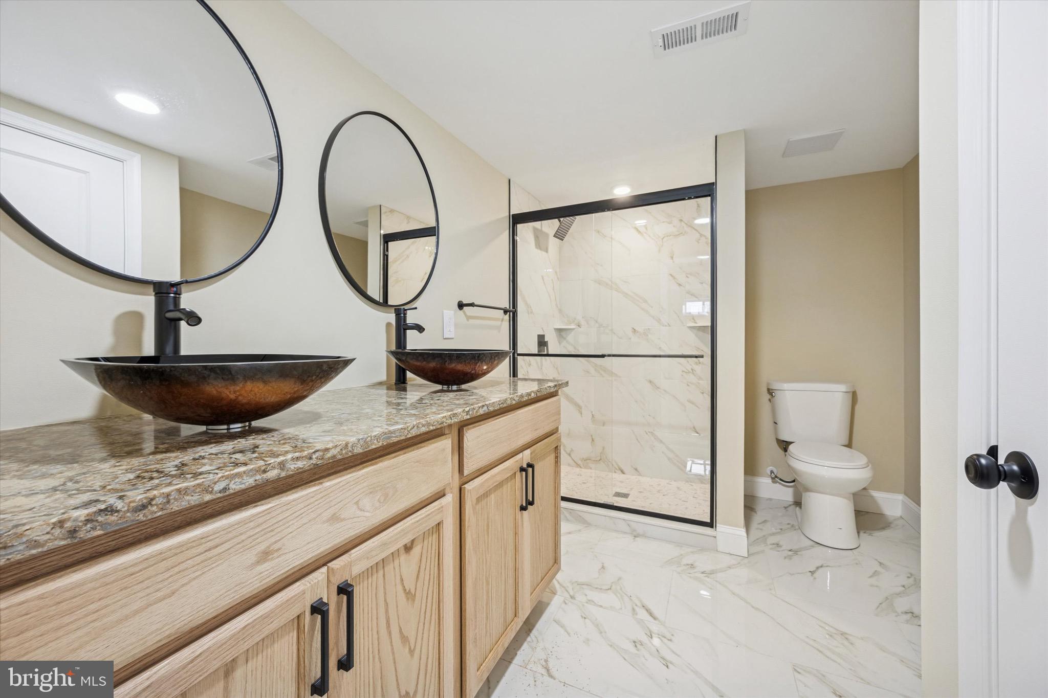 19 Rivanna Road New Castle, DE 19720 - Photo 26 of 26 a bathroom with a granite countertop toilet a sink and a mirror