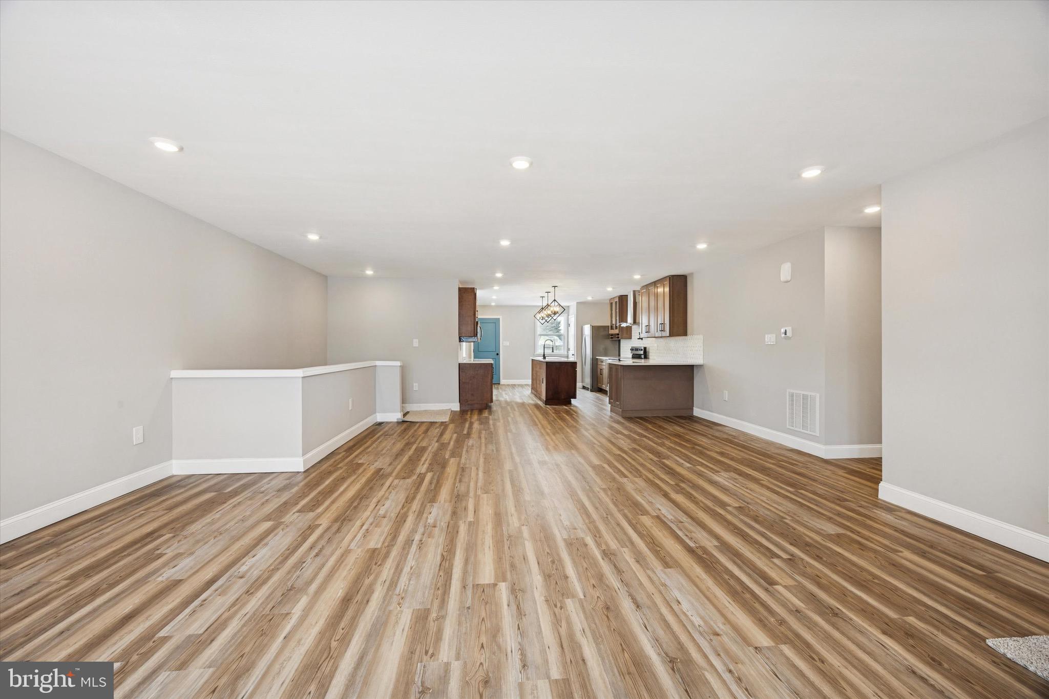 19 Rivanna Road New Castle, DE 19720 - Photo 5 of 26 a view of kitchen with furniture and wooden floor