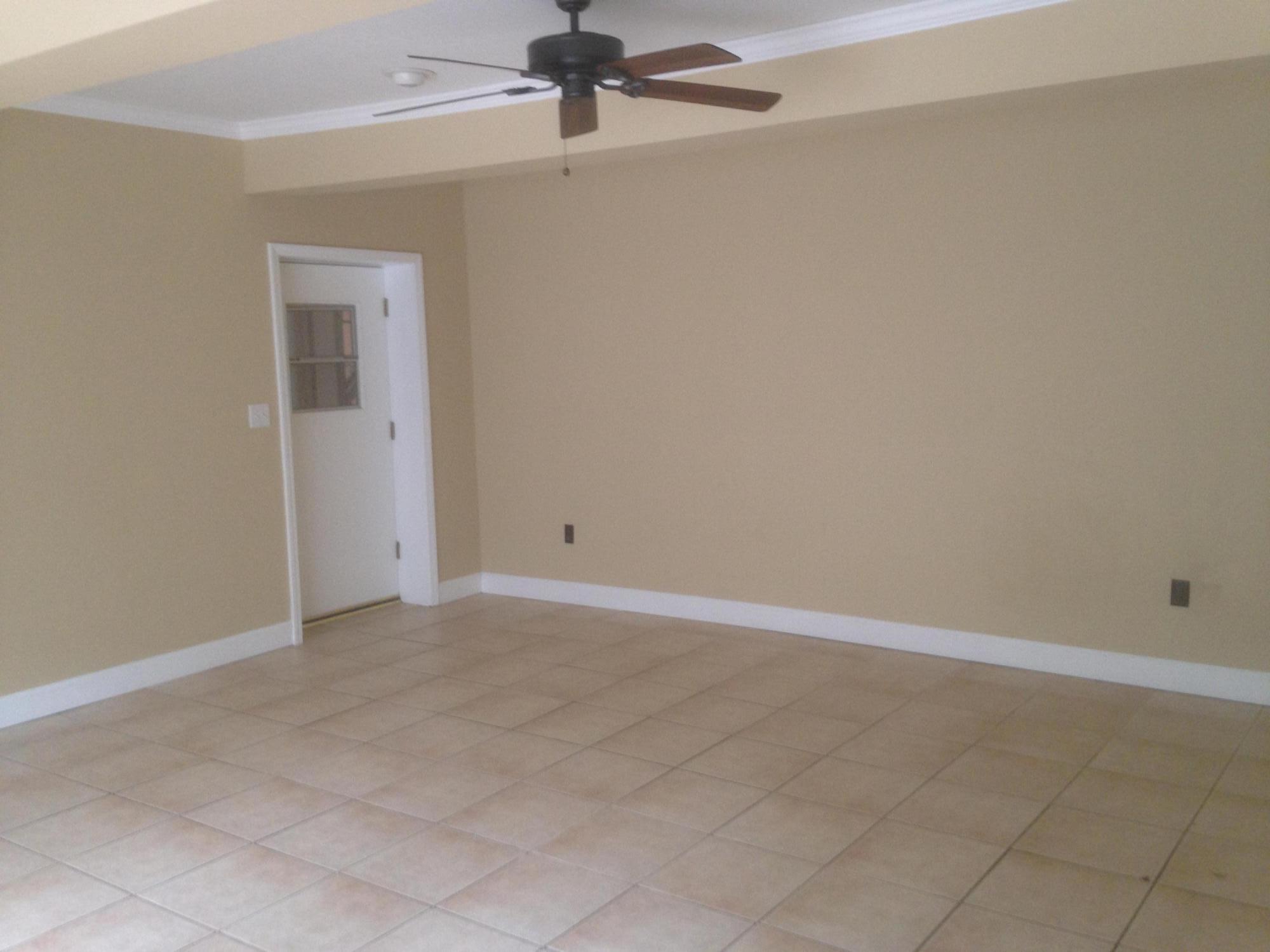 226 Country Club Road Shalimar, FL 32579 - Photo 19 of 35 an empty room with a ceiling fan and carpet
