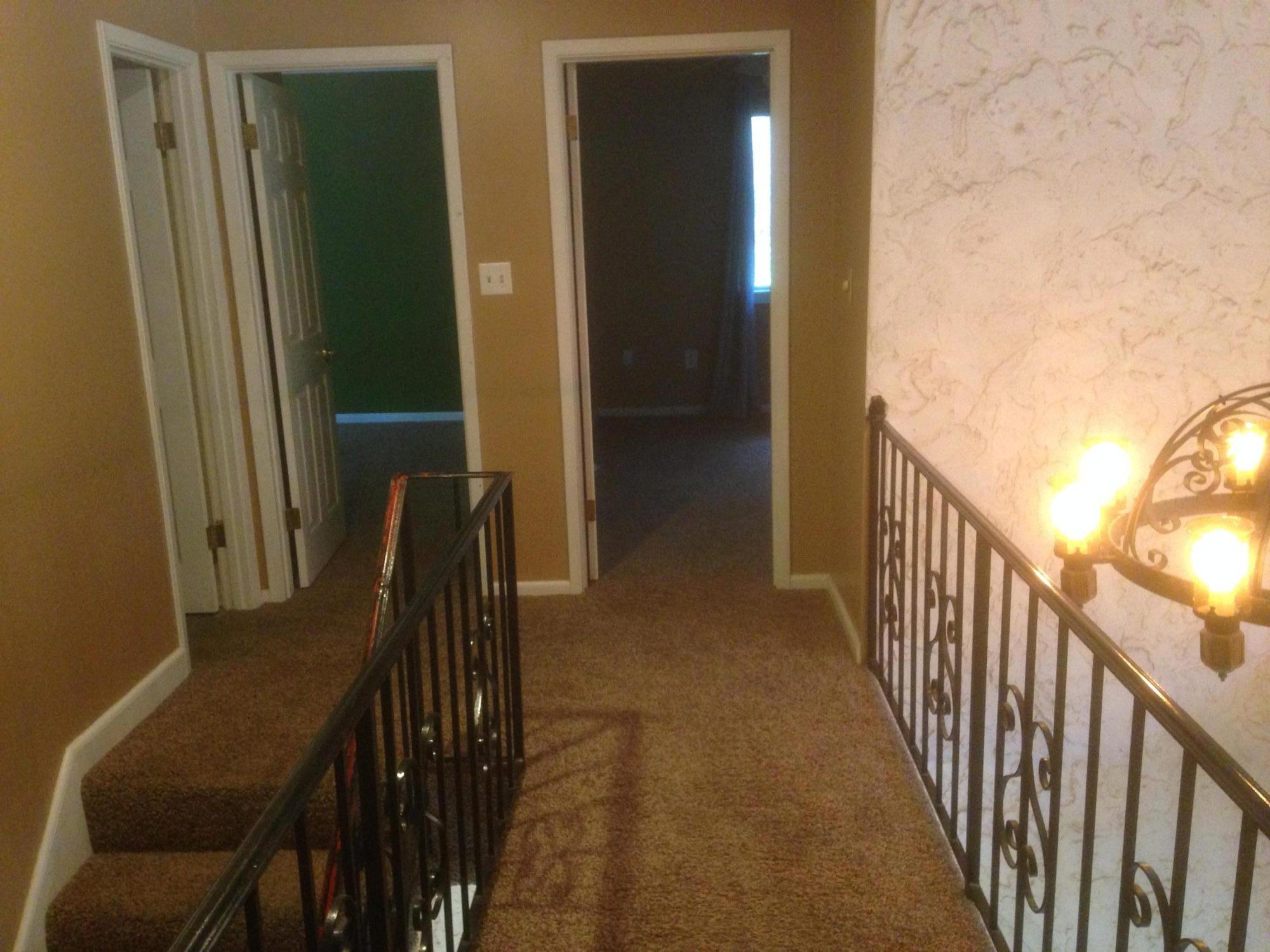 226 Country Club Road Shalimar, FL 32579 - Photo 25 of 35 a view of a hallway with wooden floor and stairs
